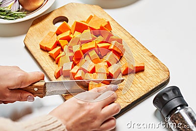 Woman slicing carrots Stock Photo