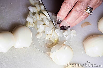 Woman slicing onions Stock Photo