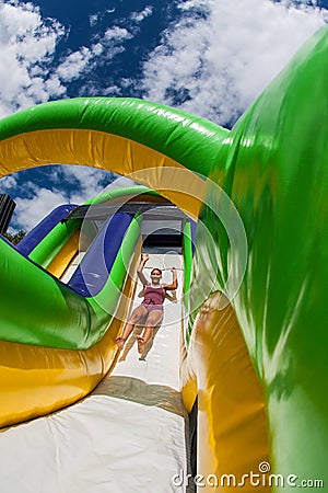 Woman Slides Down Obstacle Course Inflatable Slide At Fitness Event Editorial Stock Photo