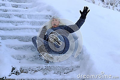 A woman slipped and fell on a wintry staircase Stock Photo