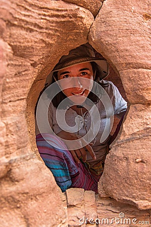 Woman in a small cave Stock Photo