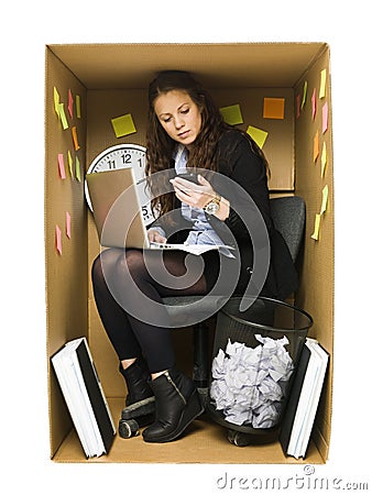 Woman in a small office Stock Photo