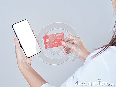 Woman with smartphone and credit card Stock Photo