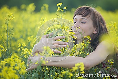 Woman smelling flowers Stock Photo