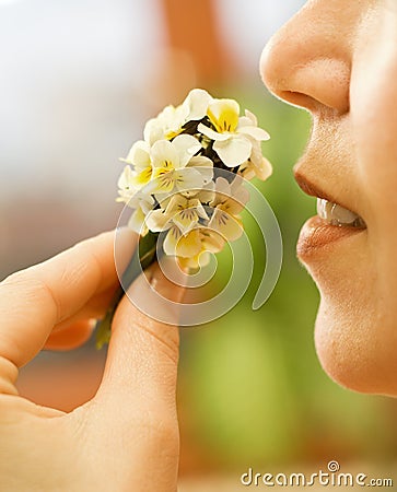 Woman smelling the flowers Stock Photo