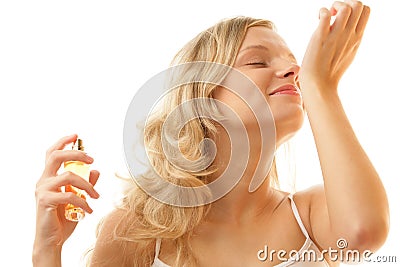 Woman smelling perfume from wrist Stock Photo