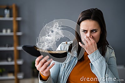 Woman Smelling Stinky Shoes. Feet Sweat Stock Photo