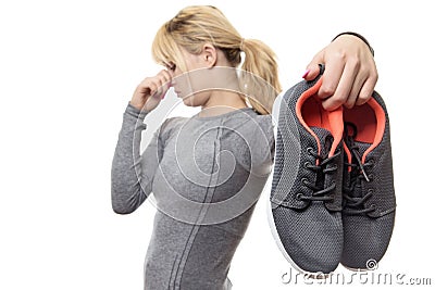 Woman with smelly shoes Stock Photo