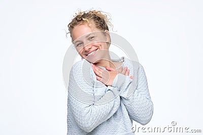 Woman smiling broadly glad to receive compliments from friends Stock Photo