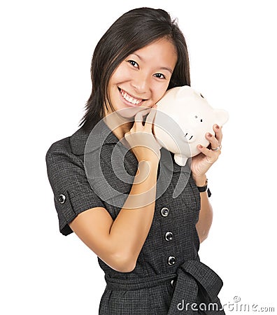 Woman smiling holding a piggy bank Stock Photo