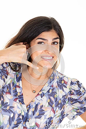 Woman smiling make phone sign gesture call me back with hand and fingers like talking on phone cell Stock Photo
