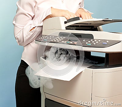 Woman with smoking copier at office Stock Photo