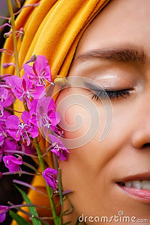 A woman with snails on her face. Natural beauty. A beautiful delicate face. Harmony. Gentle beauty. Facial massage with snails Stock Photo