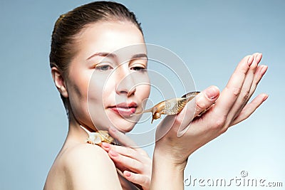 Woman with snails Stock Photo