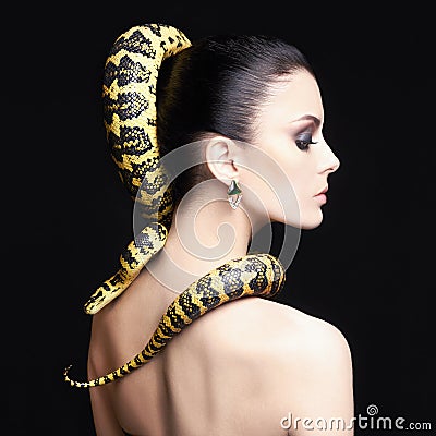 Woman with Snake on her hair Stock Photo