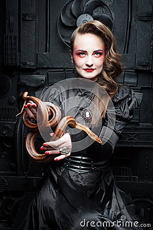 Woman with a snake. Stock Photo
