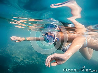Woman snorkel in shallow water Stock Photo