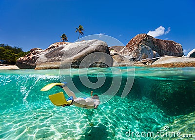 Woman snorkeling in tropical water Stock Photo