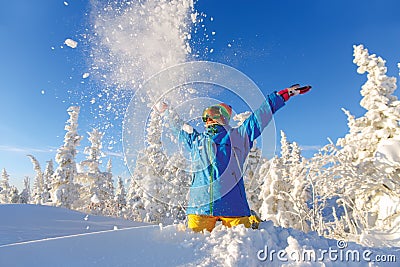 Woman snowboarder having fun in a fantastic winter forest Stock Photo