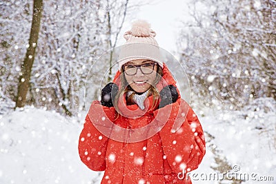 Woman in snowfall Stock Photo