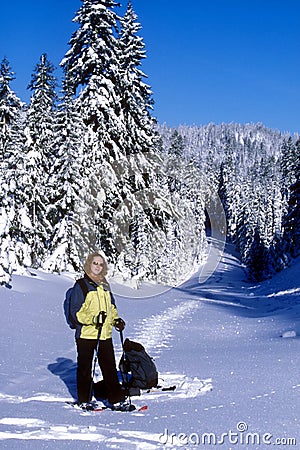 Woman Snowshoeing Winter Sports Scenery Stock Photo