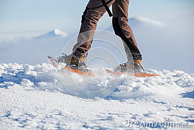 Woman snowshoeing in winter Carpathian mountains Stock Photo