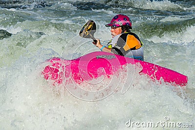 Woman in some white water Editorial Stock Photo