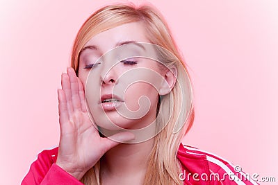 Woman speaking, young girl whispering over pink Stock Photo