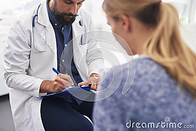 Woman speaks to doctor about her ailment Stock Photo