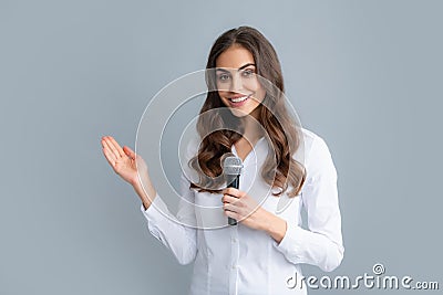 Woman speech, business woman holding a microphone. Public speaking with microphone, speaker speech presentation concept Stock Photo