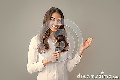 Woman speech, business woman holding a microphone. Public speaking with microphone, speaker speech presentation concept Stock Photo