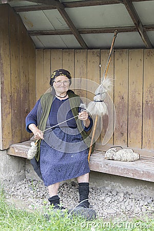 A woman spinning wool in Romania Editorial Stock Photo