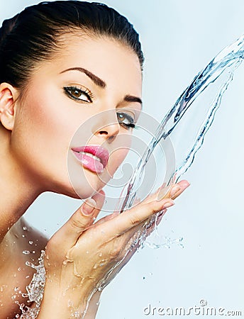 Woman with splashes of water Stock Photo