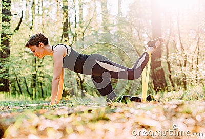Woman sport exercise pilates outside yoga comfort Stock Photo