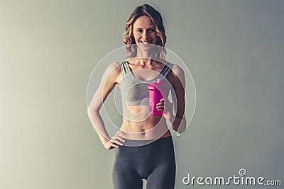 Woman with sport nutrition Stock Photo