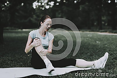 Woman in Sportswear after Yoga Exercises in Park. Stock Photo