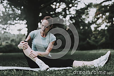 Woman in Sportswear after Yoga Exercises in Park. Stock Photo