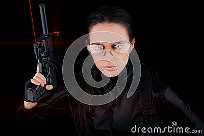 Woman Spy Holding Gun with Laser Sights Stock Photo