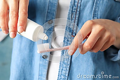 Woman squeezes toothpaste. Dental care Stock Photo