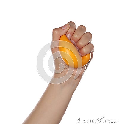 Woman squeezing antistress ball on white background, closeup Stock Photo