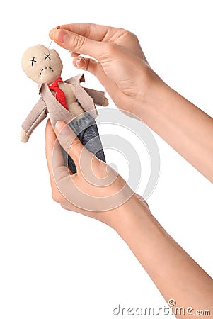 Woman stabbing voodoo doll dressed as businessman with pin on white background, closeup Stock Photo