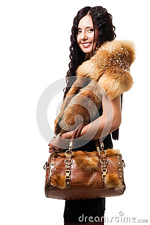Woman stand with fur and bag Stock Photo