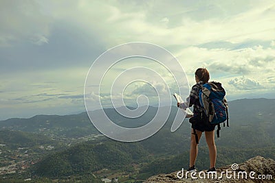 Woman stand on the mountain with travel and adventure concept. Stock Photo