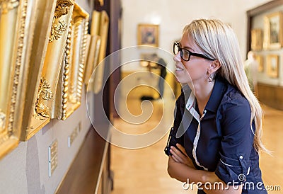 Woman standing in an art gallery Stock Photo