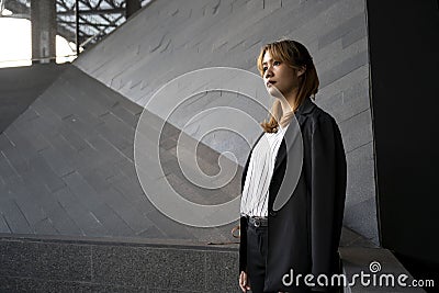 A woman standing at barricade Stock Photo