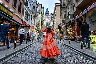 Woman standing at Galata tower in Istanbul, Turkey. Editorial Stock Photo