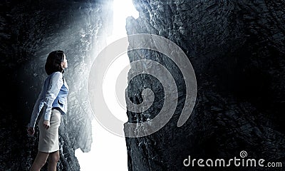 Woman standing in light Stock Photo