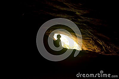 Woman standing in Rawana Ella cave in Sri lanka. Stock Photo