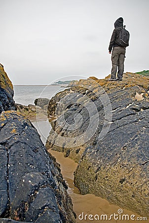 Woman standing by sea Stock Photo