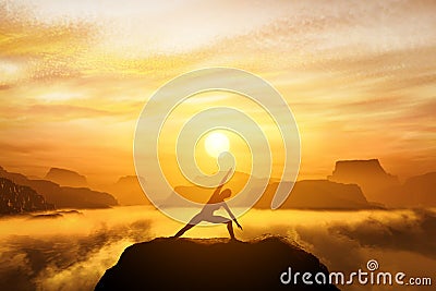 Woman standing in side angle yoga position, meditating Stock Photo